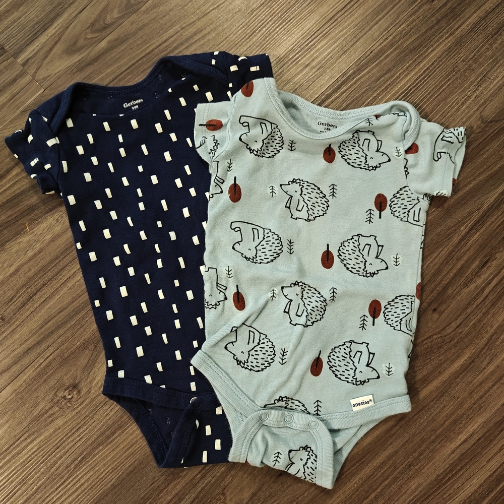 Two Carter's Navy And Blue Hedgehog Print Baby Bodysuits